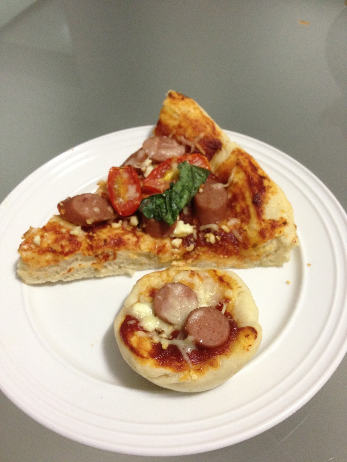 Culinary Pizza with basil leaves and mini pizzas by Lily Chua